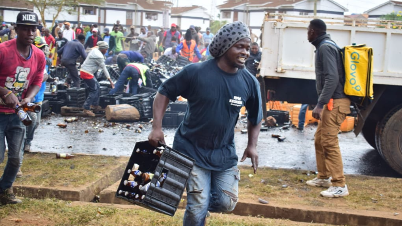 Police who looted an overturned beer truck have been arrested